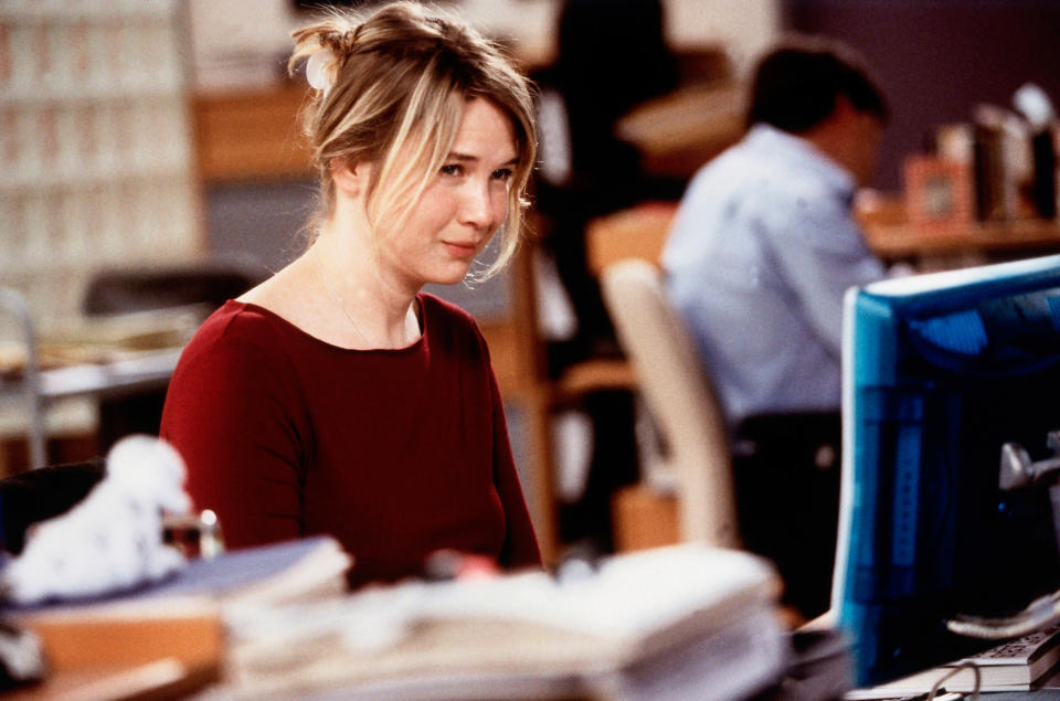 Renee Zellweger looking unimpressed as her character working at a computer in Bridget Jones's Diary