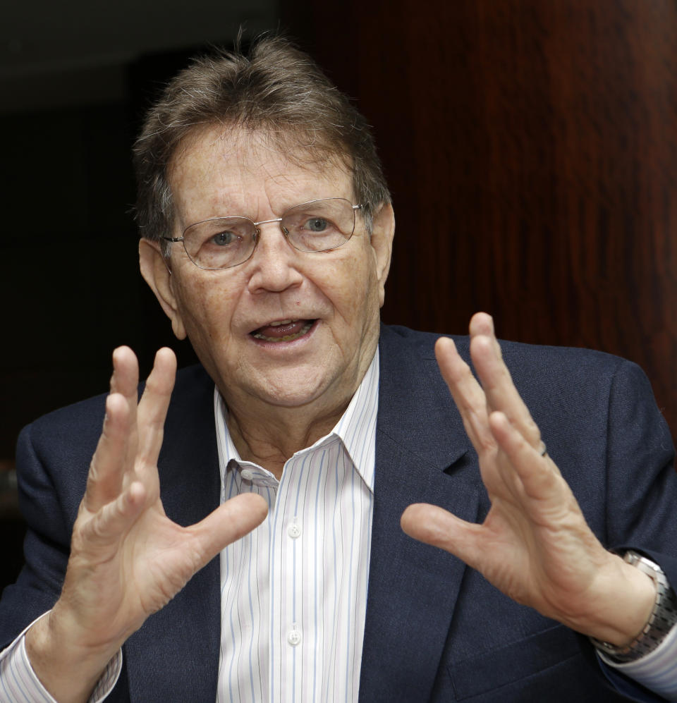 FILE - In this July 17, 2014, file photo, German-born minister Reinhard Bonnke speaks during an interview in Miami. Bonnke, a Pentecostal preacher whose crusades across Africa drew millions with the promise of faith healings, died Dec. 7, 2019, the ministry he founded announced. He was 79. (AP Photo/Alan Diaz, File)