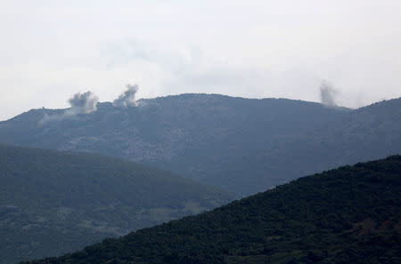 Smoke rises on the mountains as seen from Northern Afrin countryside, Syria, February 15, 2018. REUTERS/Khalil Ashawi