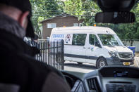 In this Sept. 2020 photo, Emergency Medical Technician (EMT) Christian Hawks with CAHOOTS, a mental health crisis intervention program, prepares for an afternoon shift in Eugene, Oregon. When police respond to a person gripped by a mental health or drug crisis, the encounter can have tragic results. Now a government health program will help communities set up an alternative: mobile teams of practitioners trained in de-escalating such potentially volatile situations. (William Holderfield via AP)