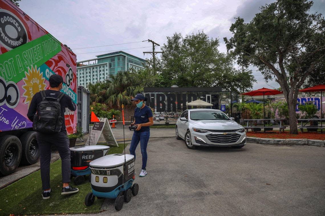 Uber Eats is using robots like these made by Cartken to deliver food in Miami-Dade, first in Dadeland area and then early next year around the county.