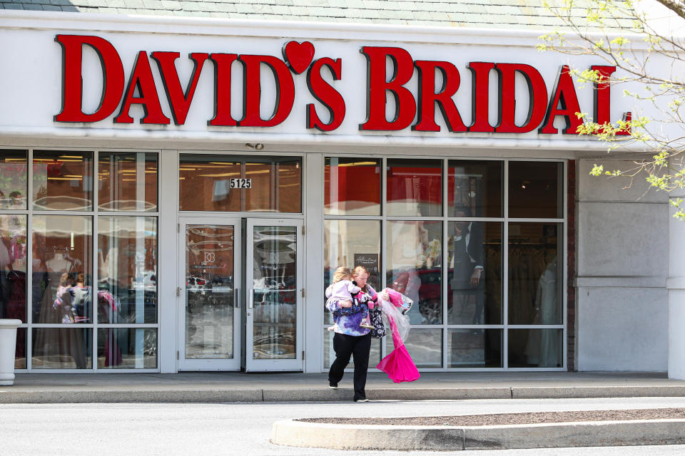 BAGE SUGAITE, HARRISBURG, PENNSYLVANIA, UNITED STATES - 2023/04/18: Shoppers exit from David&#39;s Bridal Shop near Harrisburg. David&#39;s Bridal LLC announced on Monday, April 17, 2023, that it filed for protection under Chapter 11 of the U.S. Bankruptcy Code. The announcement comes just days after the company announced it would lay off more than 9,200 employees. (Photo by Paul Weaver/SOPA Images/LightRocket via Getty Images)