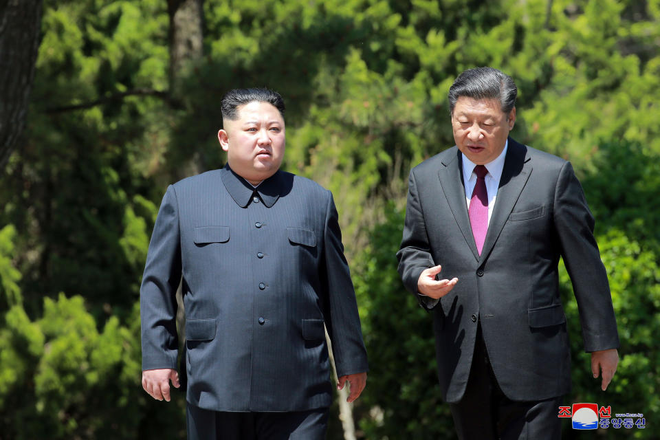 North Korean leader Kim Jong Un walks with China's President Xi Jinping during a visit to Dalian, China in this undated photo released on May 9, 2018 by North Korea's Korean Central News Agency (KCNA). KCNA/via REUTERS   ATTENTION EDITORS - THIS PICTURE WAS PROVIDED BY A THIRD PARTY. REUTERS IS UNABLE TO INDEPENDENTLY VERIFY THE AUTHENTICITY, CONTENT, LOCATION OR DATE OF THIS IMAGE. THIS PICTURE IS DISTRIBUTED EXACTLY AS RECEIVED BY REUTERS, AS A SERVICE TO CLIENTS. NO THIRD PARTY SALES. NOT FOR USE BY REUTERS THIRD PARTY DISTRIBUTORS. SOUTH KOREA OUT. NO COMMERCIAL OR EDITORIAL SALES IN SOUTH KOREA.