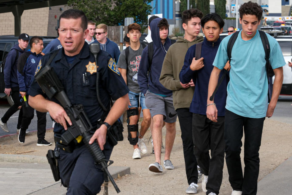 Law enforcement oversees the evacuation of students from Saugus high. Source: Getty Images