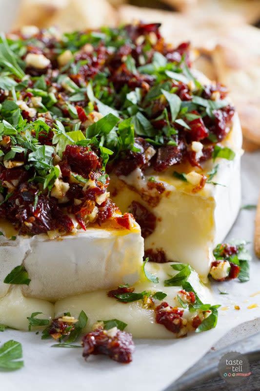 <p>Taste and Tell</p><p>The festive toppings make this recipe a showstopper.</p><p><strong>Get the recipe: <a href="http://www.tasteandtellblog.com/baked-brie-recipe-with-sun-dried-tomatoes/" rel="nofollow noopener" target="_blank" data-ylk="slk:Baked Brie Recipe with Sun-Dried Tomatoes;elm:context_link;itc:0;sec:content-canvas" class="link ">Baked Brie Recipe with Sun-Dried Tomatoes</a></strong></p><p><strong>Related: <a href="https://parade.com/847078/christinehadden/50-christmas-appetizers-youll-want-all-year-long/" rel="nofollow noopener" target="_blank" data-ylk="slk:50 Best Christmas Party Appetizer Ideas;elm:context_link;itc:0;sec:content-canvas" class="link ">50 Best Christmas Party Appetizer Ideas</a></strong></p>