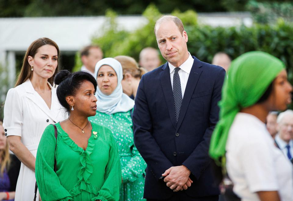 Britain's Prince William, Duke of Cambridge (C) and Britain's Catherine, Duchess of Cambridge, (L) attend a memorial service at the foot of Grenfell Tower in London, on June 14, 2022, the fifth anniversary of the Grenfell Tower fire where 72 people lost their lives. - The names of the 72 people who perished in Britain's worst residential fire since World War II were read out on June 14, 2022 at a church service marking the fifth anniversary of the blaze. Survivors and families of the victims of the Grenfell Tower fire gathered at Westminster Abbey for the first of a day of events to remember the tragedy. (Photo by PETER NICHOLLS / POOL / AFP) (Photo by PETER NICHOLLS/POOL/AFP via Getty Images)