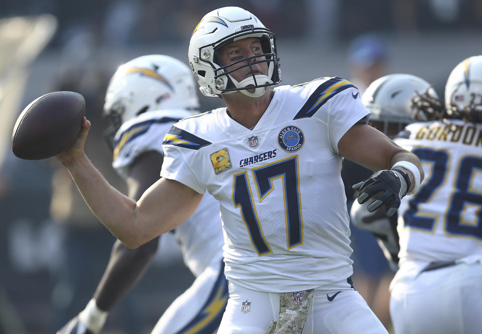 Los Angeles Chargers quarterback Philip Rivers (17) passes against the Oakland Raiders during the first half of an NFL football game in Oakland, Calif., Sunday, Nov. 11, 2018. (AP Photo/Ben Margot)