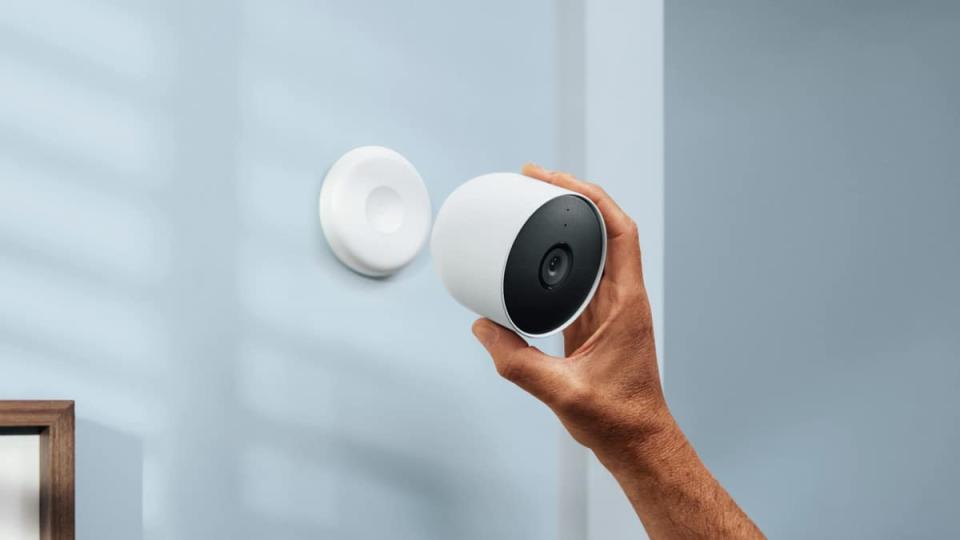 nest cam being placed on a wall