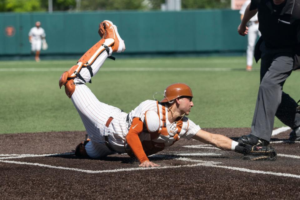 Texas catcher Rylan Galvan atempts to tag out a runner at home plate during a game against Texas Tech at UFCU Disch-Falk Field last March. He and Texas A&M transfer Kimble Schuessler are contending for the starting job.