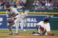 Jun 9, 2018; Detroit, MI, USA; Cleveland Indians second baseman Jason Kipnis (22) miss plays the ball as Detroit Tigers catcher James McCann (34) slides into second safe in the seventh inning at Comerica Park. Mandatory Credit: Rick Osentoski-USA TODAY Sports