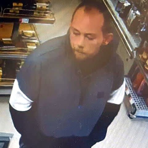 CCTV of John Tomlin in a shop whilst trying to evade police - Credit: Metropolitan Police/PA