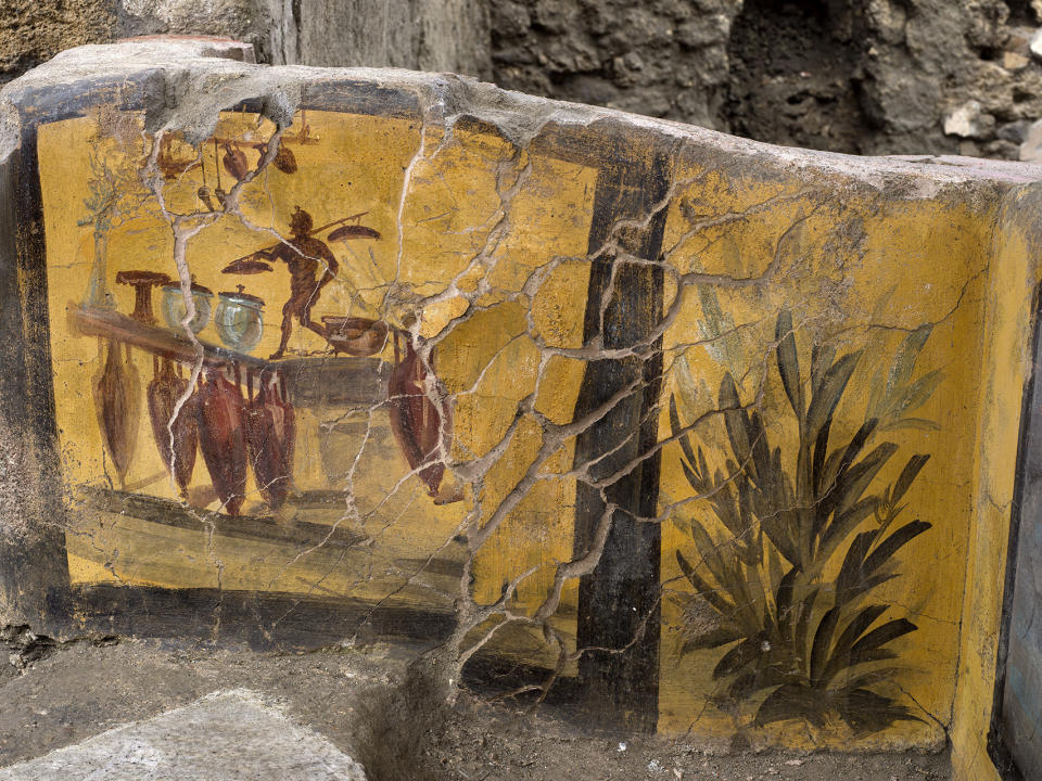 An undated photo made available by the Pompeii Archeological park press office shows the thermopolium in the Pompeii archeological park, near Naples, Italy. A fast-food eatery discovered at Pompeii is now completely excavated, helping to reveal some favorite dishes of citizens of the ancient Roman city who liked to eat out. Pompeii Archaeological Park’s longtime chief, Massimo Osanna said Saturday, Dec. 26, 2020, in a statement that while some 80 such fast-foods have been found at Pompeii, it is the first time such an eatery — known as a thermopolium since it serve hot foods — had been entirely excavated. (Luigi Spina/Parco Archeologico di Pompei via AP)