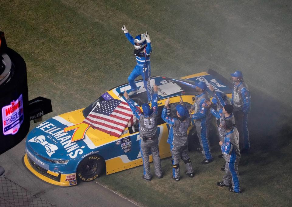 Justin Allgaier celebrates with his team after winning in the Wawa 250 on Friday night at Daytona International Speedway.