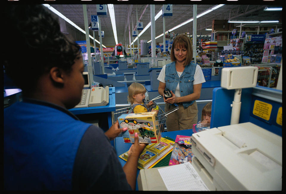 A woman at a checkout counter