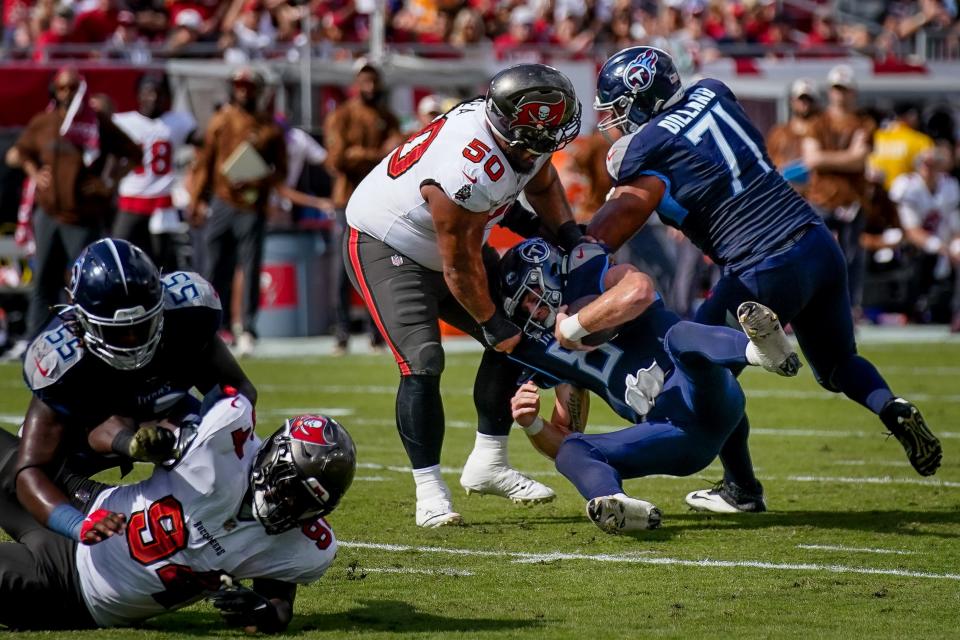 Tennessee Titans quarterback Will Levis (8) is sacked by Tampa Bay Buccaneers defensive tackle Vita Vea (50) next to offensive tackle Andre Dillard (71) during the first quarter at Raymond James Stadium in Tampa, Fla., Sunday, Nov. 12, 2023.