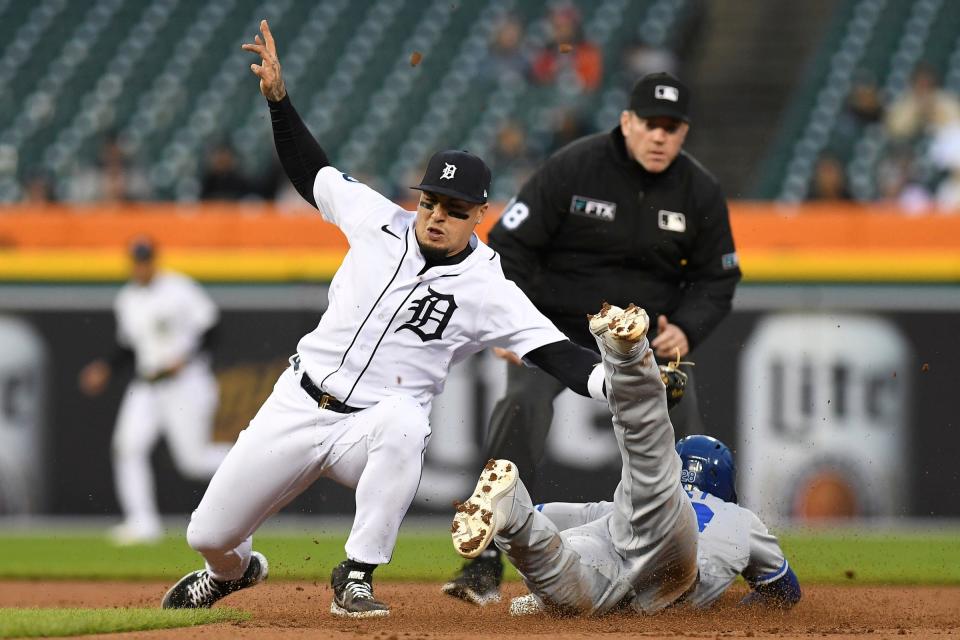 Detroit Tigers shortstop Javier Baez (28) (left) takes a throw from catcher Eric Haase (not pictured) before tagging out Kansas City Royals right fielder Kyle Isbel (28) at second base on a stolen base attempt in the second  inning at Comerica Park in Detroit on Wednesday, Sept. 28, 2022.
