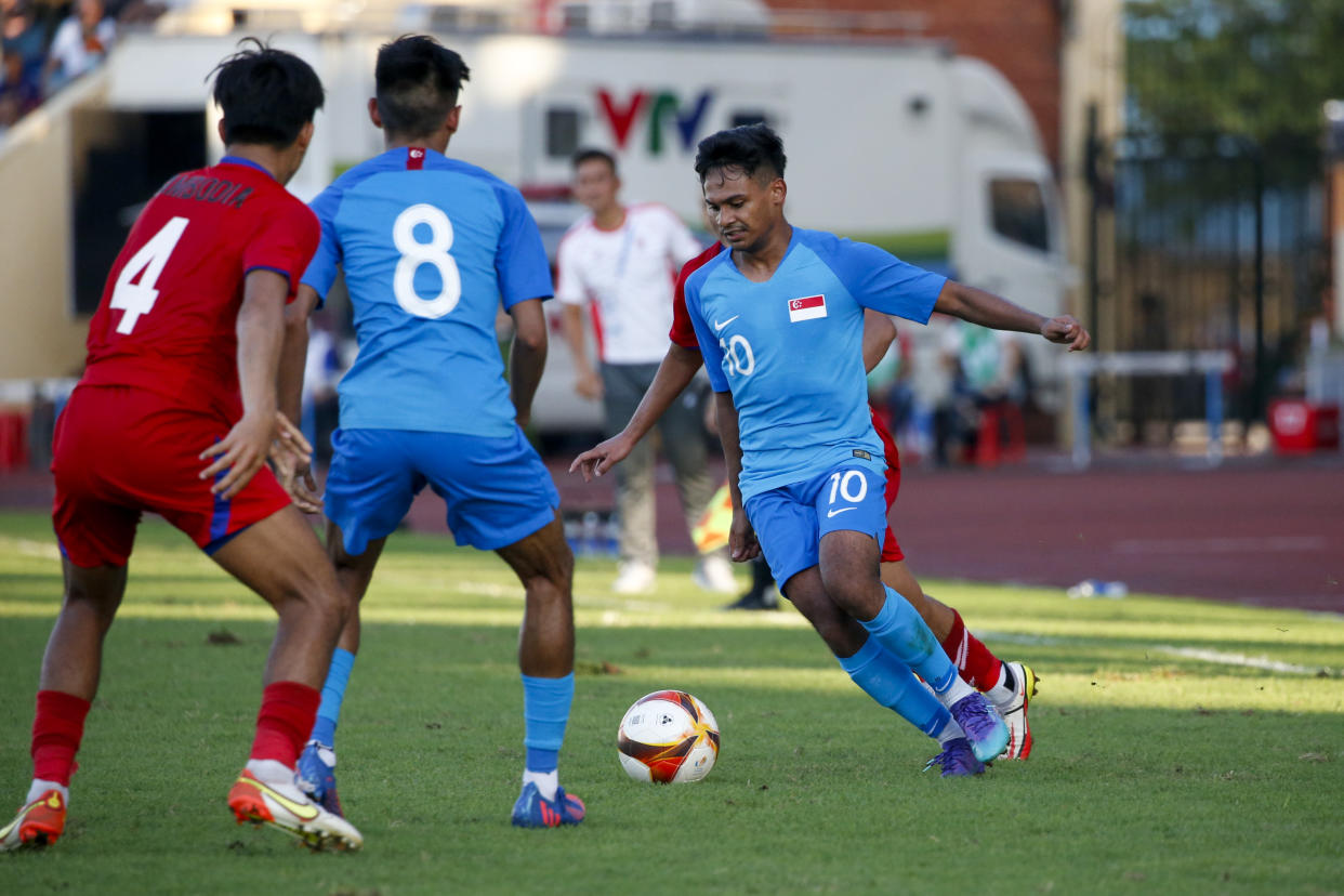 Singapore forward Saifullah Akbar in action against Cambodia at the SEA Games men's football competition. He scored the winning goal of the match. (PHOTO: SNOC/Samuel Ang)
