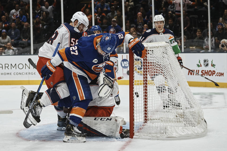New York Islanders' Anders Lee, center scores a goal during the second period of an NHL hockey game against the Columbus Blue Jackets on Saturday, Dec. 1, 2018, in Uniondale, N.Y. (AP Photo/Andres Kudacki)