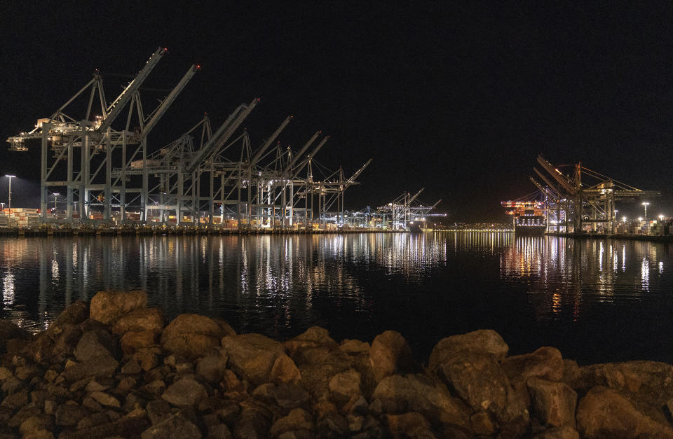 The Container ship Cam Cgm Arctic (MT), right, is moored at Maersk APM Terminals Pacific, Pier 400, at the Port of Los Angeles on Monday, Nov. 21, 2022. The supply backlogs of the past two years -- and the delays, shortages and outrageous prices they brought with them -- have improved dramatically since summer. (AP Photo/Damian Dovarganes)