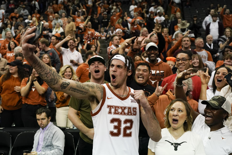 Texas forward Christian Bishop celebrates after their win against Xavier in a Sweet 16 college basketball game in the Midwest Regional of the NCAA Tournament Friday, March 24, 2023, in Kansas City, Mo. (AP Photo/Charlie Riedel)