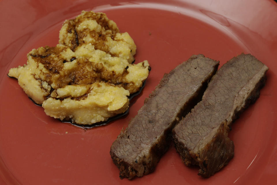 In this Friday, May 31, 2013 photo displayed is a plate of salt beef, with “Indian Mush,” an inmate dinner from the 1800s, at Eastern State Penitentiary in Philadelphia. The historic penitentiary plans to serve visitors sample meals from the 1800s, 1900s and today on June 8th and 9th. (AP Photo/Matt Rourke)