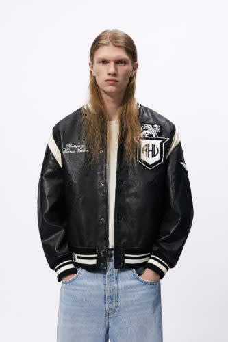 blacl leather varsity jacket with white details