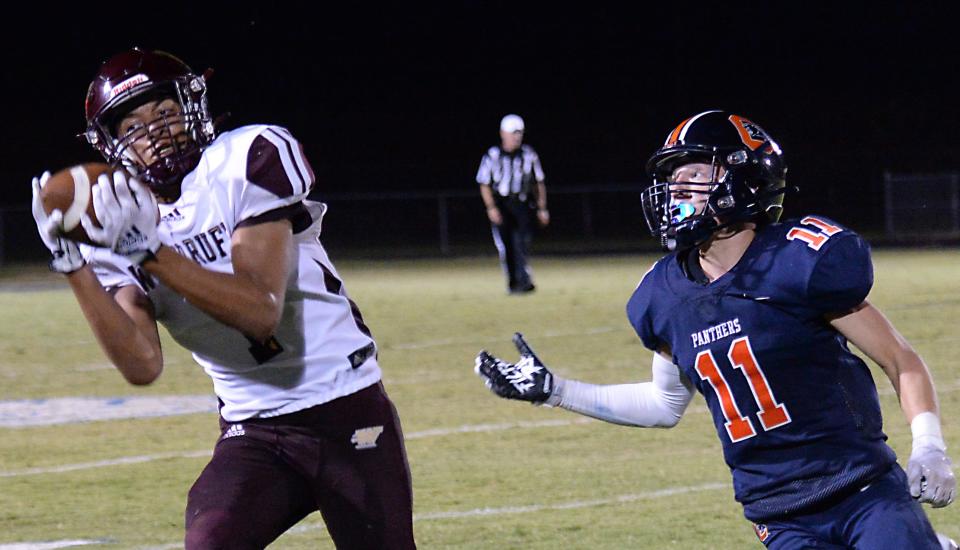 Woodruff played Chapman in high school football at Chapman High School on Aug. 19, 2022.  Woodruff's Anthony Graybill (1) WR/DB pulls down a key pass as Chapman's Cole Daugherty (11) WR/DB tries to make the play.  Woodruff goes on to beat Chapman in overtime 13-7. 