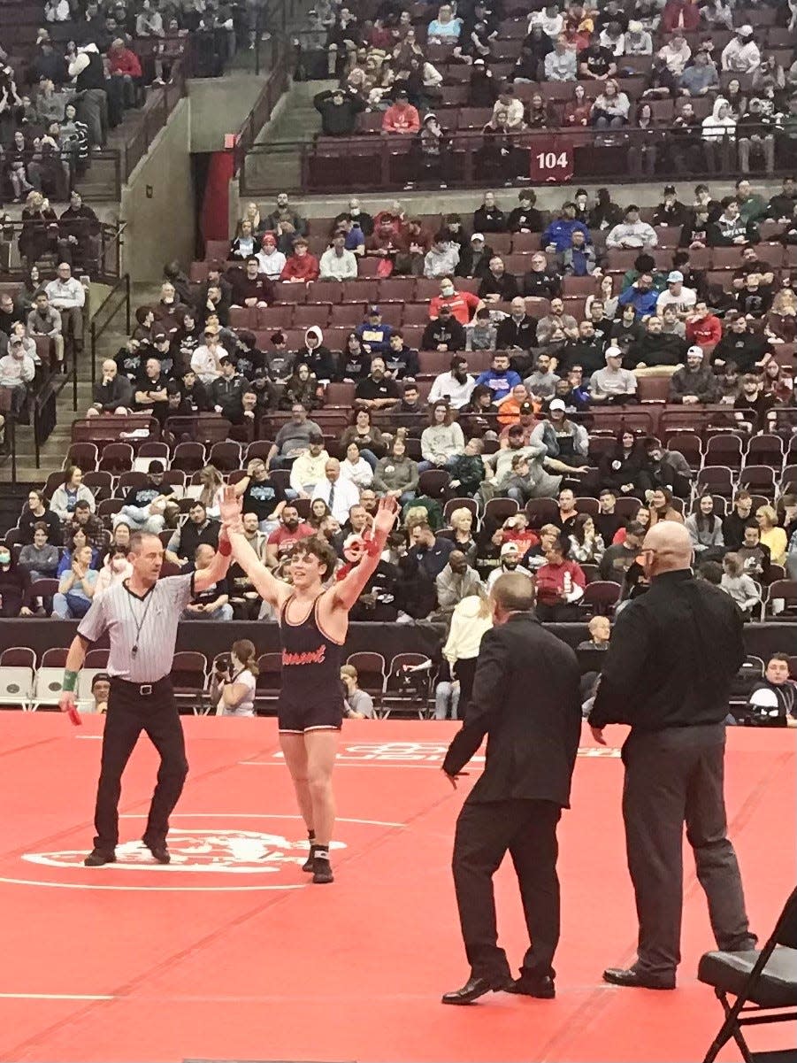 Pleasant senior Carter Chase gets his hand raised after winning the 165-pound Division III state championship Sunday night at Ohio State's Schottenstein Center.