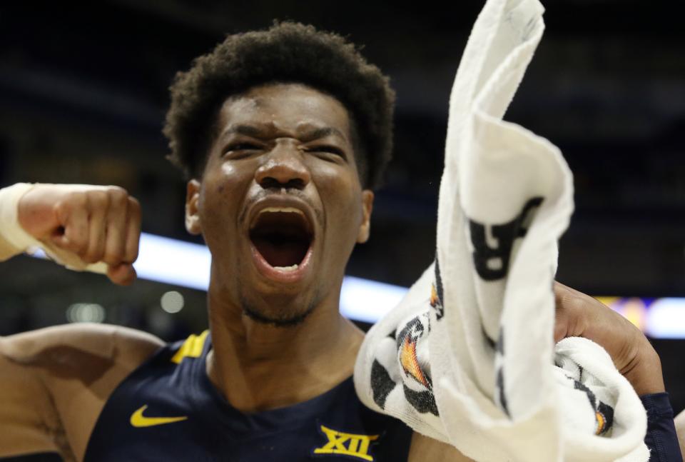 West Virginia forward Mohamed Wague (11) reacts after the Mountaineers' 81-56 victory over Pittsburgh last November in Pittsburgh. Wague was at Kansas State last week for a recruiting visit.