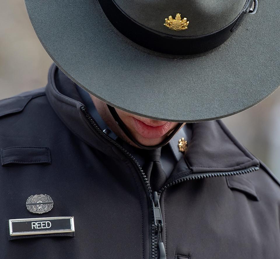 Pennsylvania State Trooper, Lt. Adam Reed, wears a mourning pin, during the viewing of Pennsylvania State Trooper Martin Mack III, held at the Wade Funeral Home in Bristol Borough, on Wednesday, March 30, 2022.