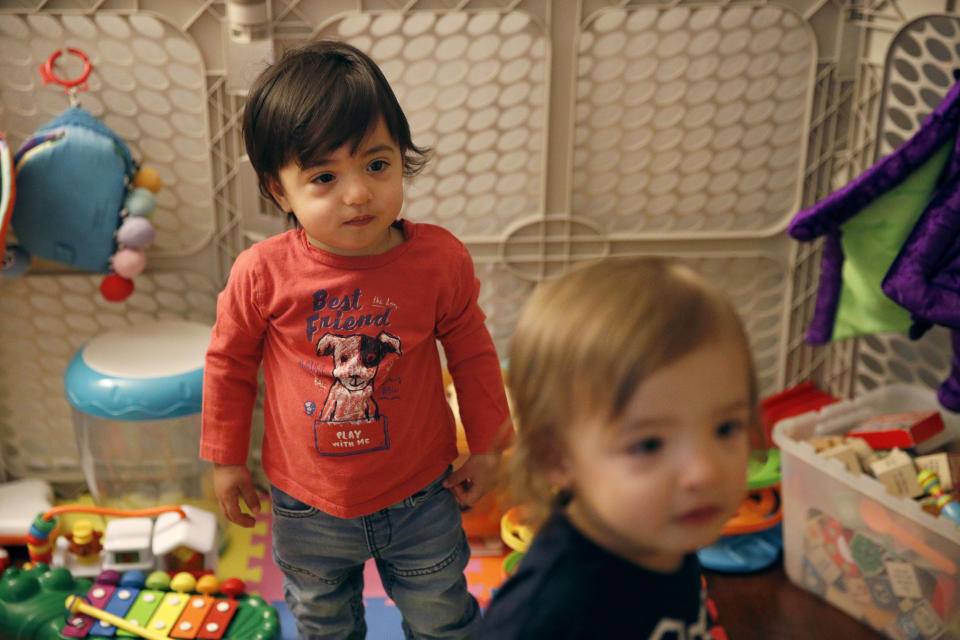 FILE - This Jan. 23, 2018, file photo shows 16-month-old Ethan Dvash-Banks, left, and his twin brother, Aiden, playing in the living room of their apartment in Los Angeles. A federal appeals court has ruled against the U.S. State Department in its quest to deny the citizenship of the son born abroad to a gay married couple. In a decision issued Oct. 9, 2020, the 9th U.S. Circuit Court of Appeals unanimously upheld a lower court ruling recognizing the citizenship from birth of Ethan Dvash-Banks, a twin boy born abroad by surrogacy to Andrew and Elad Dvash-Banks, a married gay couple. (AP Photo/Jae C. Hong, File)