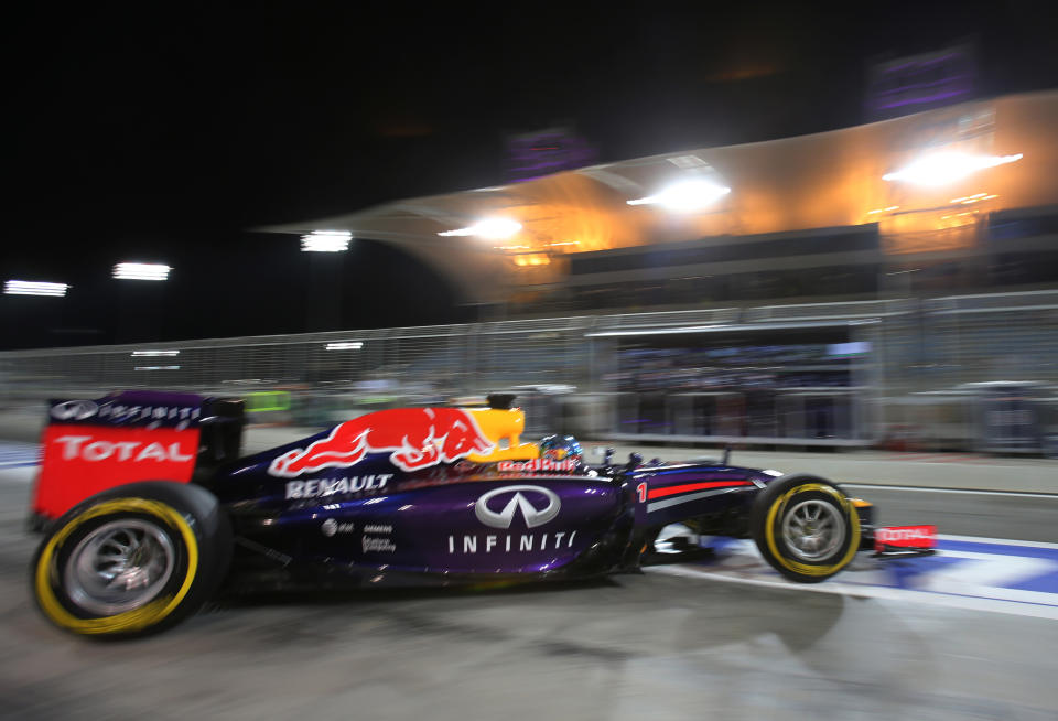 Red Bull driver Sebastian Vettel of Germany leaves the garage during the second practice session of the Bahrain Formula One Grand Prix at the Formula One Bahrain International Circuit in Sakhir, Bahrain, Friday, April 4, 2014. The Bahrain Formula One Grand Prix will take place here on Sunday. (AP Photo/Kamran Jebreili)