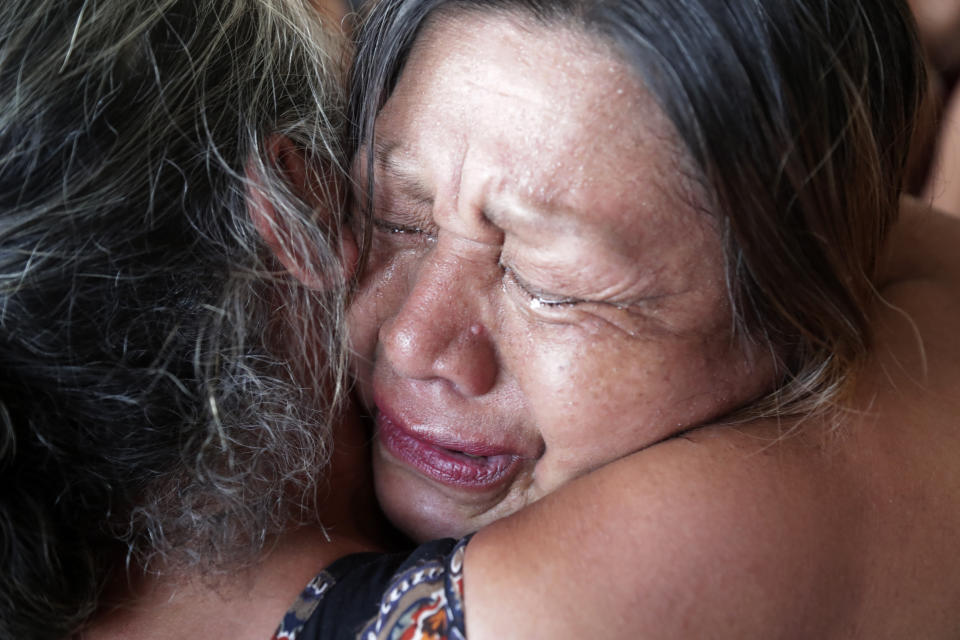 An Indigenous woman cries tears of happiness after learning that the Supreme Court ruled to enshrine Indigenous land rights, in Brasilia, Brazil, Thursday, Sept. 21, 2023. Six of the 11 Supreme Court justices voted against establishing a cut-off date after which Indigenous peoples could not claim new territory. (AP Photo/Gustavo Moreno)