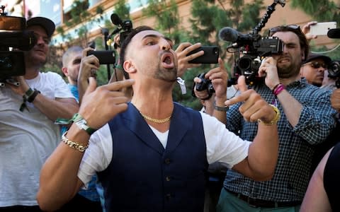 Boxer Paulie Malignaggi calls out to UFC lightweight champion Conor McGregor as he leaves Toshiba Plaza in Las Vegas - Credit: Reuters