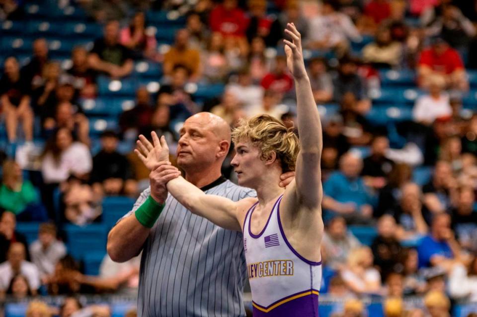 Valley Center junior Aiden Shields has his hand raised after winning the 120-pound title at the Class 5A state tournament at Hartman Arena on Saturday.