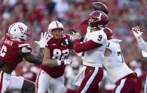 Indiana quarterback Connor Bazelak (9) passes the ball while under pressure from Nebraska edge rusher Caleb Tannor (2) during the first half of an NCAA college football game Saturday, Oct. 1, 2022, in Lincoln, Neb. (AP Photo/Rebecca S. Gratz)
