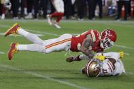 Kansas City Chiefs' Tyrann Mathieu (32) tackles San Francisco 49ers' Emmanuel Sanders (17) during the second half of the NFL Super Bowl 54 football game Sunday, Feb. 2, 2020, in Miami Gardens, Fla. (AP Photo/Seth Wenig)