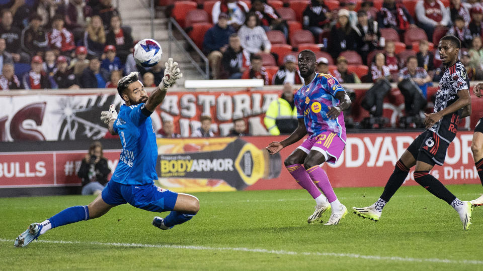 New York Red Bulls goalkeeper Carlos Coronel, left, tries to reach the ball kicked by Toronto FC forward Prince Osei Owusu, center, during an MLS soccer match Saturday, Oct. 7, 2023, in Harrison, N.J. (AP Photo/Eduardo Munoz Alvarez)