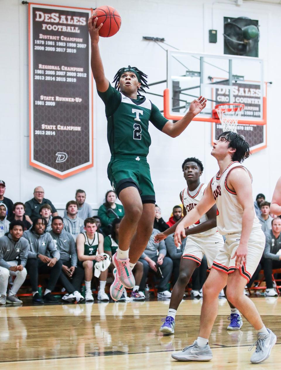 Trinity's Drae Vasser scores two of his 40 points as the Rocks beat DeSales 75-71 in overtime. Nov. 28, 2023