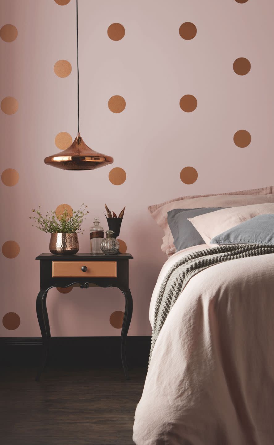 <p>Using paint as a decorative element is a really fun way to make walls look individual. For this girls' bedroom idea, use a circle template to make the gold dots after you've painted the wall pink. And don't forget you can paint furniture too – this elegant side table is painted black with a gold drawer to match the walls. Then add in a gold pendant and some dusky pink bedding to accessorise.</p><p>Pictured: Pashmina, Copper and Jet Black emulsion, <a href="https://www.crownpaints.co.uk/products/standard-emulsion/matt/pashmina%C2%AE/182" rel="nofollow noopener" target="_blank" data-ylk="slk:Crown;elm:context_link;itc:0;sec:content-canvas" class="link ">Crown</a></p>