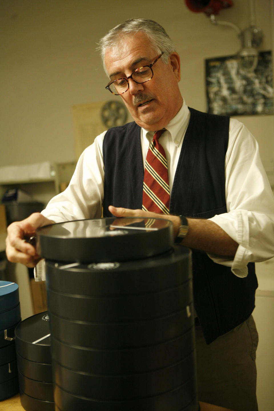 This undated publicity photo released by the Library of Congress shows Patrick Loughney, chief of the Packard Campus of the National Audio-Visual Conservation Center, reviewing films to be preserved at the Library of Congress' Conservation Center in Culpeper, Virginia. (AP Photo/Library of Congress, Abby Brack Lewis)