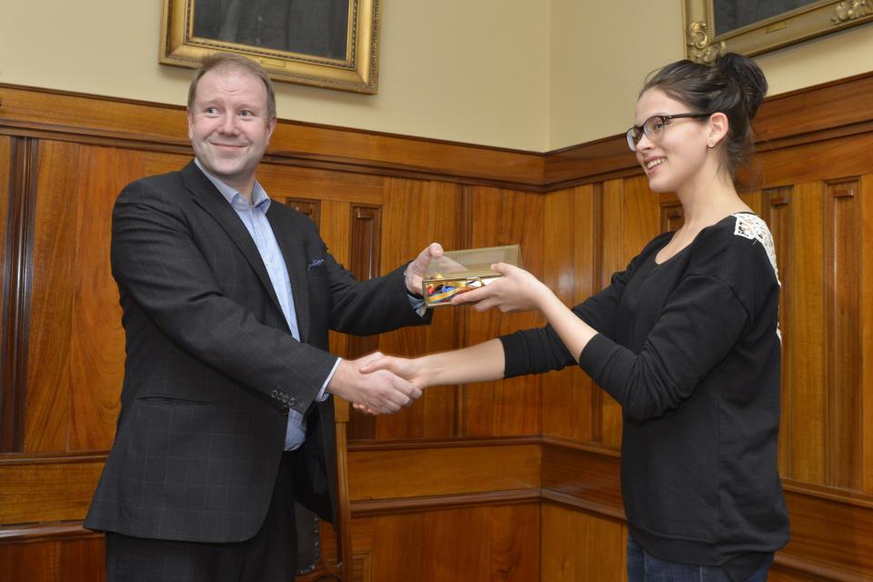 Finnish 19-year old girl Sara Maria Forsberg, right, received the key to her home town from the Pietarsaari City Manager Mikael Jakobsson, at the Pietarsaari City Hall on Tuesday March 18, 2014, in symbolic recognition of her new found fame. Supermarket cashier Firsberg has more than 9 million views on her language imitation YouTube video "What languages sound like to a foreigner", and now she hopes her celebrity status will open new career opportunities for her. (AP Photo / LEHTIKUVA, Tomi Hirvinen) FINLAND OUT - NO SALES