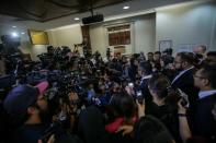 <p>Reporters and cameramen surround Najib Razak and his lawyer, Shafee Abdullah, at the Kuala Lumpur Courts Complex on Wednesday (4 July) afternoon. (PHOTO: Fadza Ishak for Yahoo News Singapore) </p>