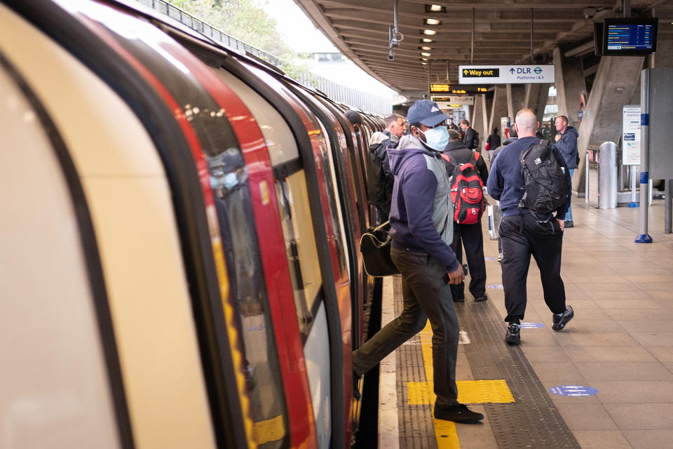 LONDON, UNITED KINGDOM - MAY 11: Commuters travel on the Jubilee line of the underground network during the evening rush hour on May 11, 2020 in London, England. Transport for London (TFL) has announced that face masks should be worn by all passengers on the tube and bus network, with hand sanitiser points being installed at stations over the coming days. The prime minister announced the general contours of a phased exit from the current lockdown, adopted nearly two months ago in an effort curb the spread of Covid-19. (Photo by Leon Neal/Getty Images)