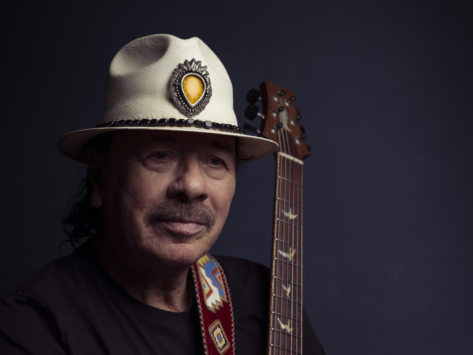 Carlos Santana poses for a portrait on Friday, June 16, 2023, in New York. (Photo by Drew Gurian/Invision/AP)