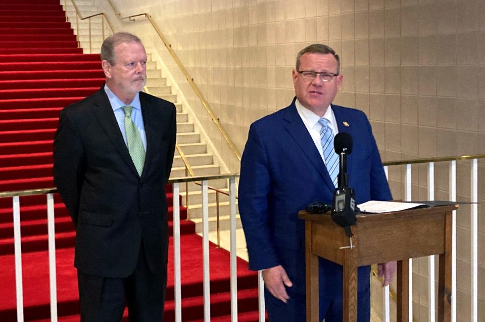 North Carolina House Speaker Tim Moore, R-Cleveland, speaks to reporters while Senate leader Phil Berger, R-Rockingham, listens at the Legislative Building in Raleigh, N.C., on Tuesday, Sept. 19, 2023. Moore and Berger announced that Republican legislative leaders were ditching efforts this year to dramatically multiply legal gambling in the state and that instead, they would pass a final budget that also will trigger Medicaid coverage to begin for hundreds of thousands of adults. (AP Photo/Gary D. Robertson)