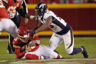 Kansas City Chiefs quarterback Patrick Mahomes, left, is sacked for a 6-yard loss by Denver Broncos defensive end Dre'Mont Jones during the second half of an NFL football game Sunday, Dec. 5, 2021, in Kansas City, Mo. (AP Photo/Charlie Riedel)