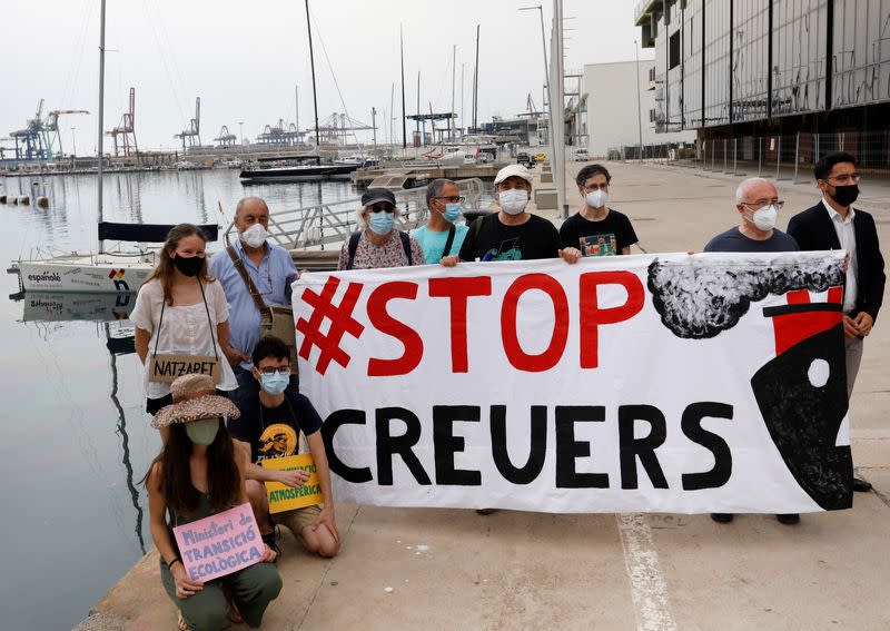 Environmental activists protest to demand an end to cruise ships docking at the Port of Valencia