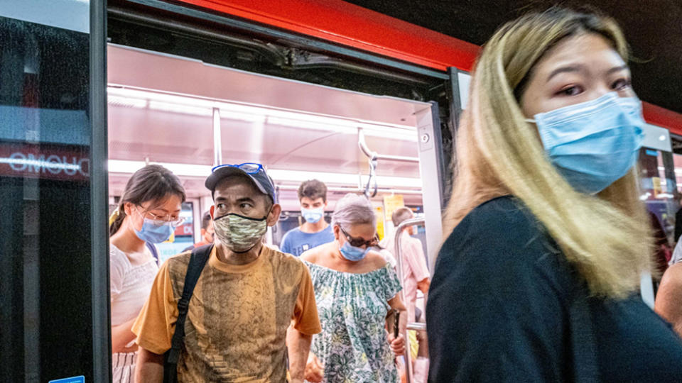People on public transport wearing face masks