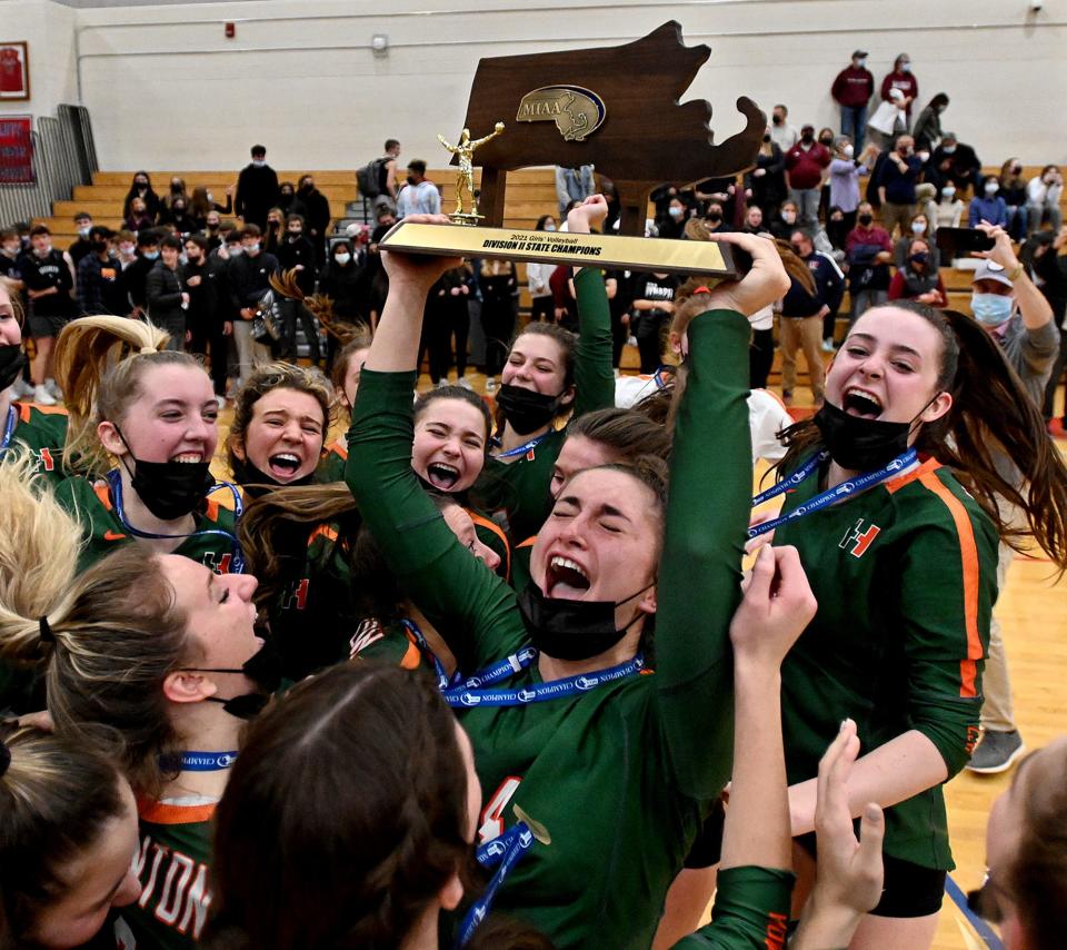 Hopkinton's Kate Powers holds up the Division 2 championship trophy as she and her teammates celebrate the win over Westborough at Tewsbury Memorial High School, Nov. 20, 2021.